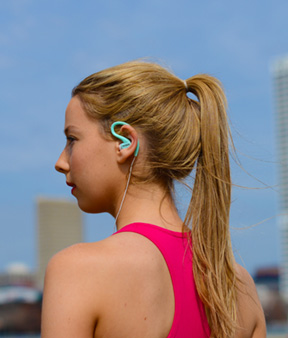 Female with lightweight compact audio headset on.